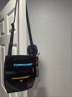 Sherpani Black Messenger Crossbody Bag with Blue and Yellow Accents